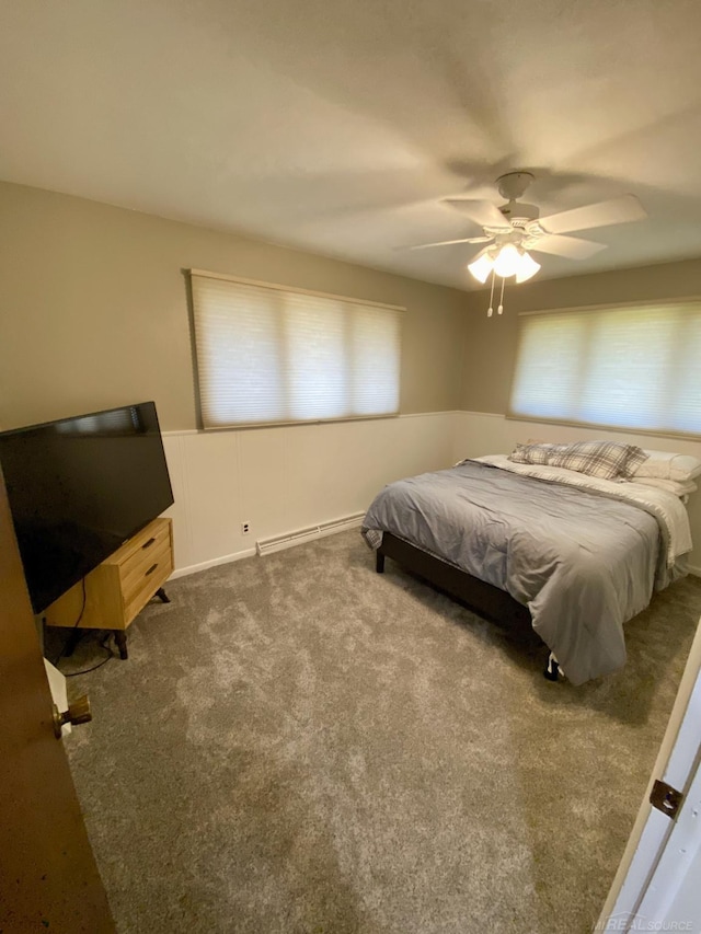 bedroom with carpet flooring, ceiling fan, and a baseboard radiator