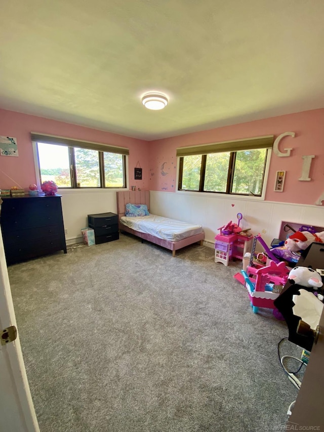 bedroom featuring carpet floors and multiple windows