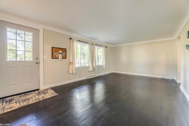 entrance foyer with dark wood-type flooring and baseboard heating