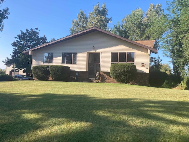 ranch-style home with a front lawn