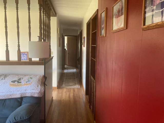 corridor featuring dark hardwood / wood-style floors