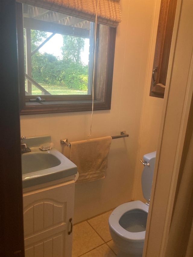 bathroom with tile patterned floors, toilet, and vanity