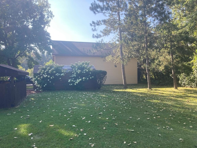 view of side of property featuring a yard