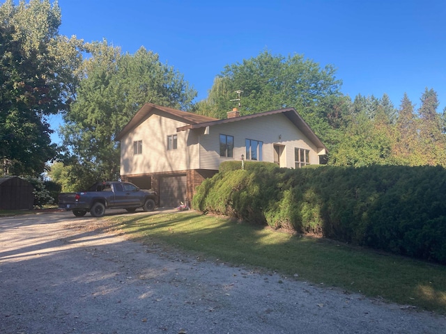 view of side of property with a yard