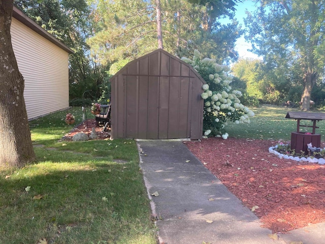 view of outbuilding featuring a yard