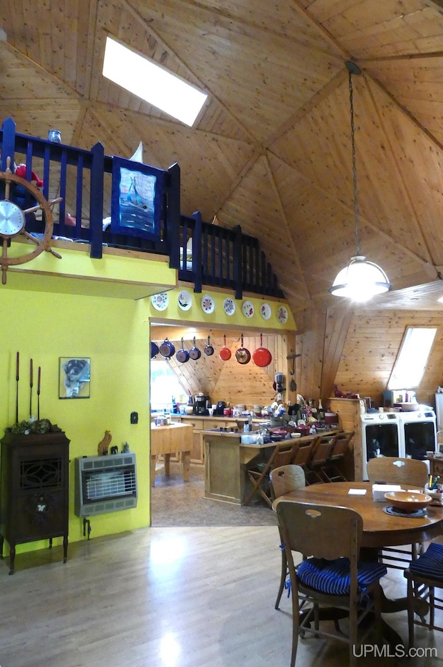 playroom with heating unit, wooden ceiling, high vaulted ceiling, and wood finished floors