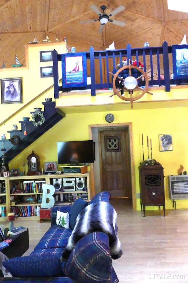 living room featuring high vaulted ceiling, a ceiling fan, heating unit, wood finished floors, and wood ceiling