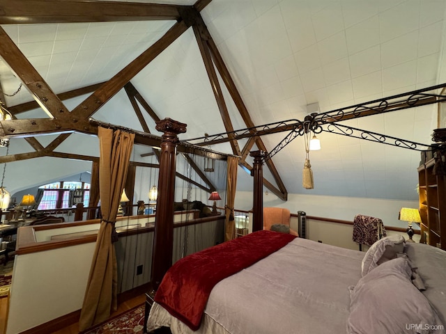 bedroom featuring lofted ceiling with beams