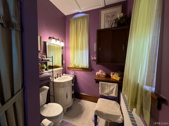 bathroom featuring vanity and toilet