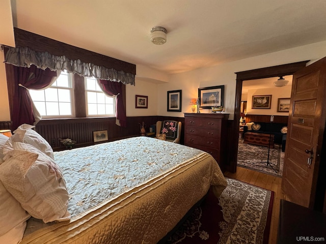 bedroom with hardwood / wood-style flooring