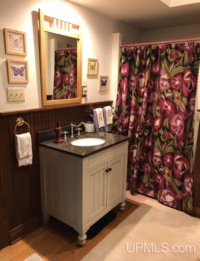 bathroom featuring hardwood / wood-style floors and vanity