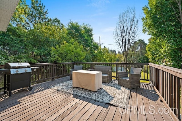 deck featuring area for grilling and an outdoor hangout area