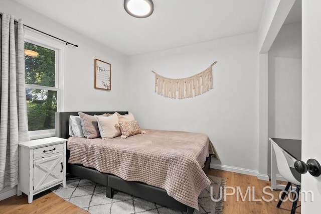 bedroom with light wood-type flooring