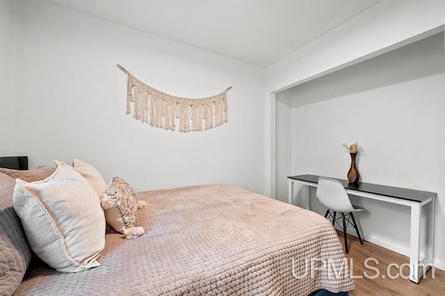 bedroom featuring hardwood / wood-style floors