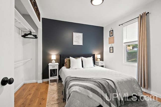 bedroom with hardwood / wood-style floors