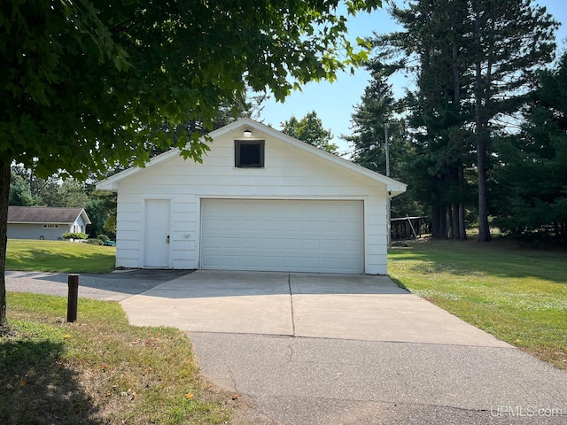 garage with a lawn