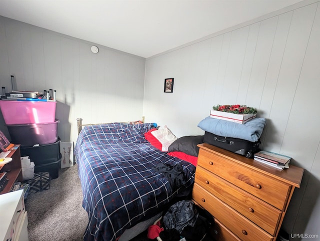 bedroom with dark colored carpet