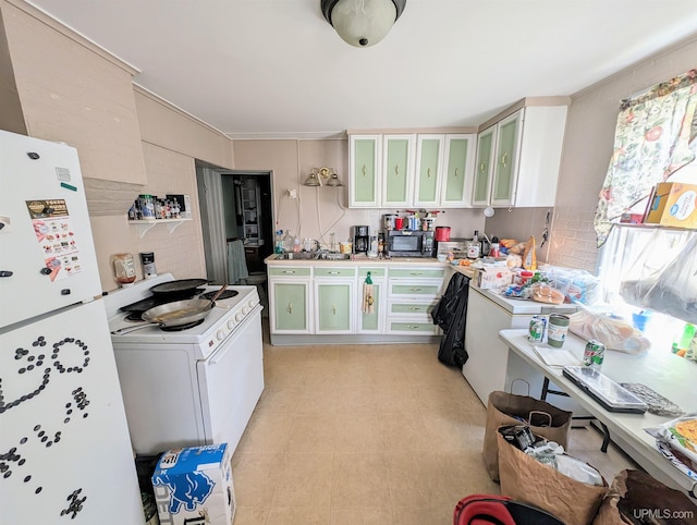 kitchen featuring white cabinets and white appliances