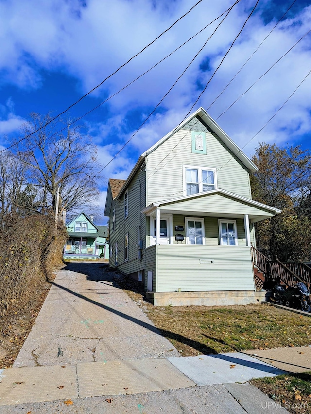 view of home's exterior featuring a porch