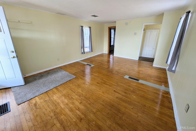 spare room featuring hardwood / wood-style floors