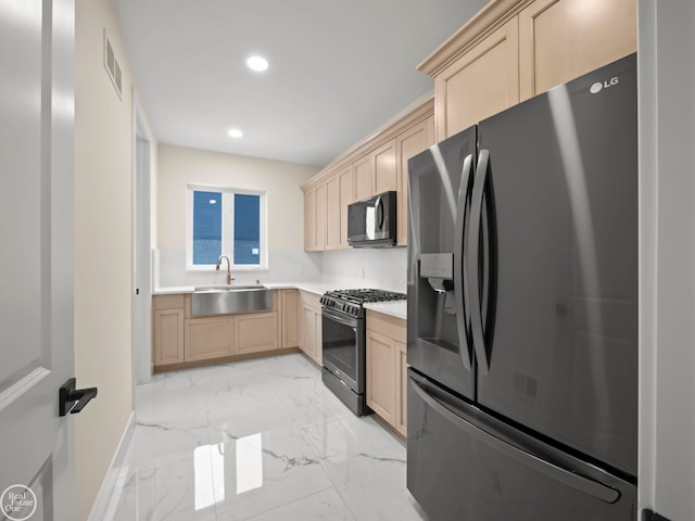 kitchen with sink, black appliances, and light brown cabinets