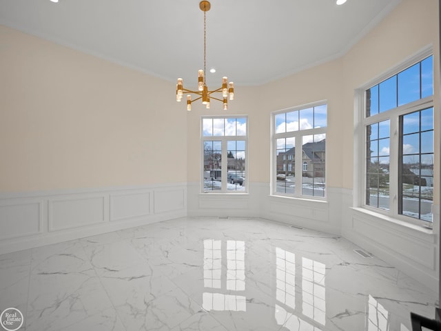 interior space with a chandelier and ornamental molding