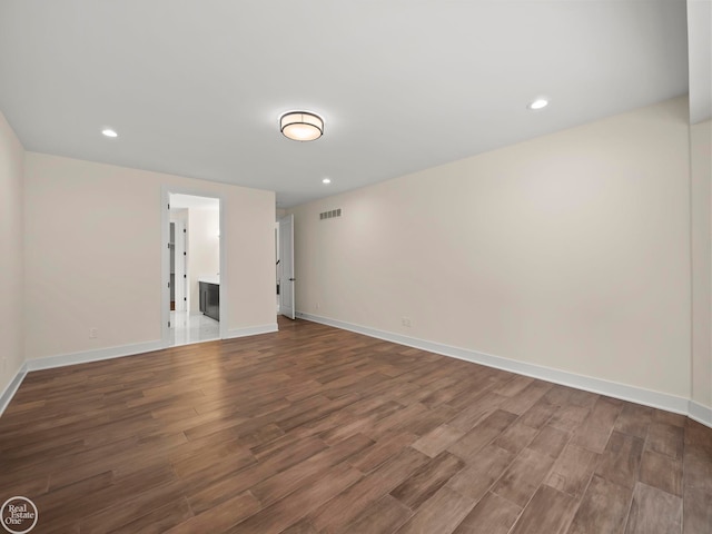 unfurnished room with hardwood / wood-style floors