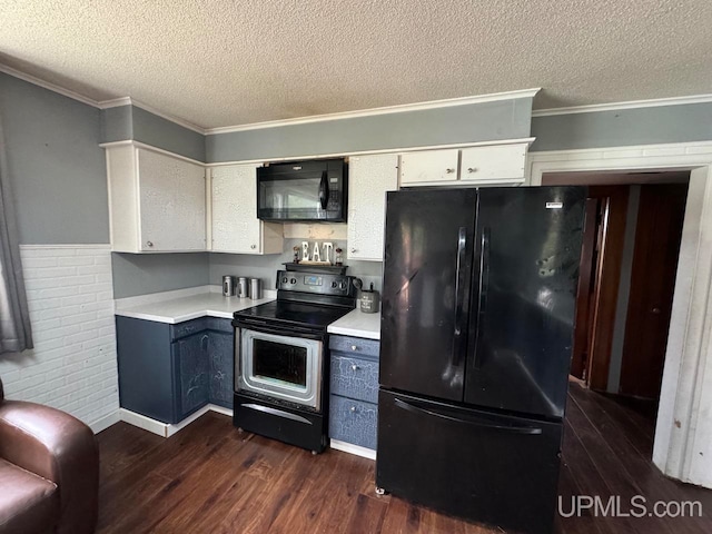 kitchen with ornamental molding, black appliances, a textured ceiling, and dark hardwood / wood-style floors