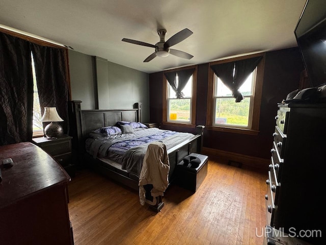 bedroom featuring ceiling fan and light hardwood / wood-style floors