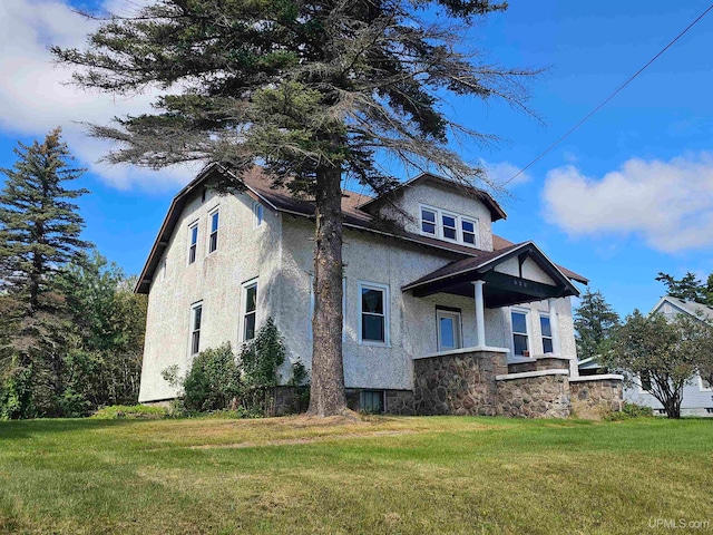 view of home's exterior featuring a lawn