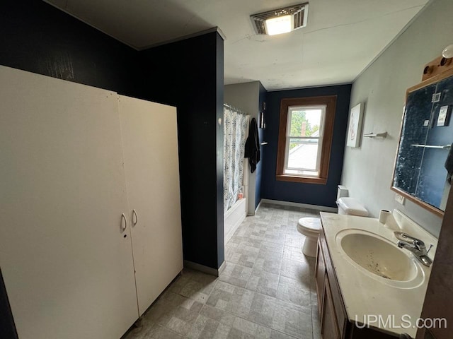 bathroom with vanity, toilet, and a shower with shower curtain