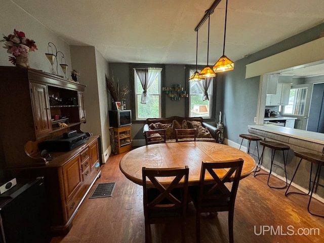 dining room featuring dark hardwood / wood-style floors