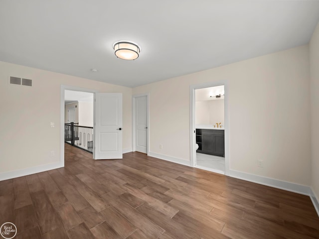 unfurnished room featuring hardwood / wood-style flooring