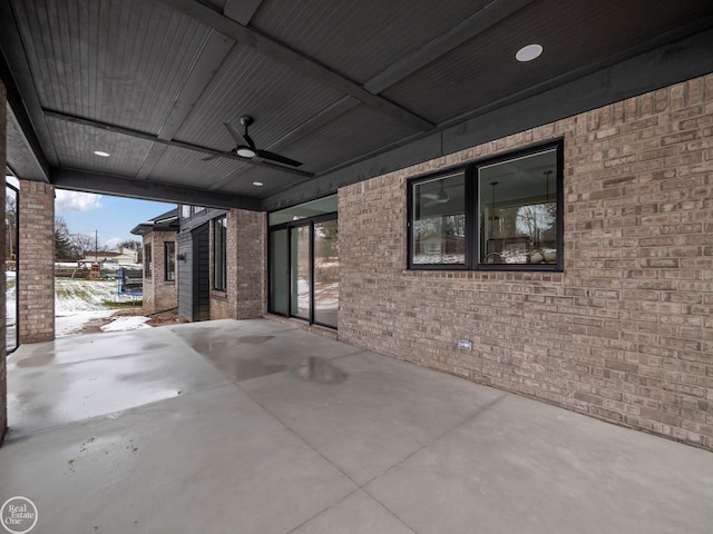 view of patio featuring ceiling fan