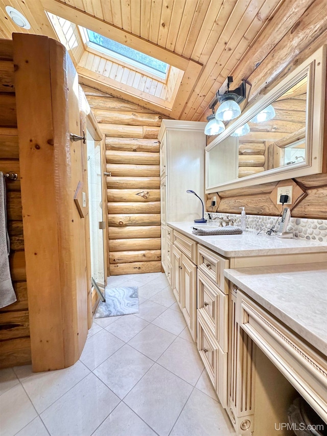 bathroom featuring tile patterned floors, wooden ceiling, vaulted ceiling with skylight, rustic walls, and vanity