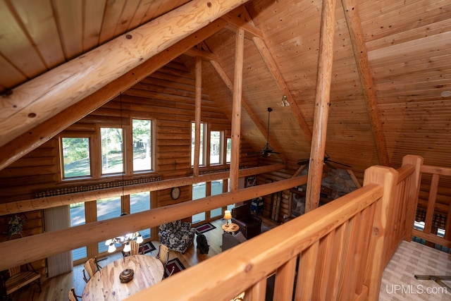 hallway with wood ceiling, beamed ceiling, hardwood / wood-style floors, and log walls