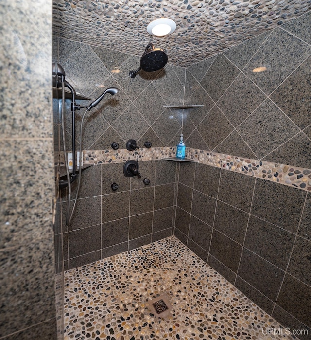 bathroom featuring a tile shower