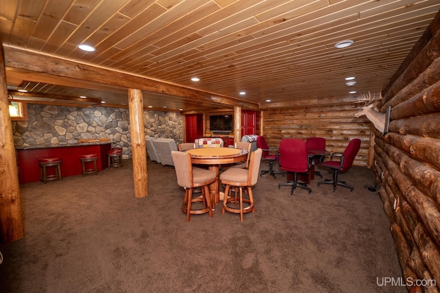 carpeted dining space featuring log walls