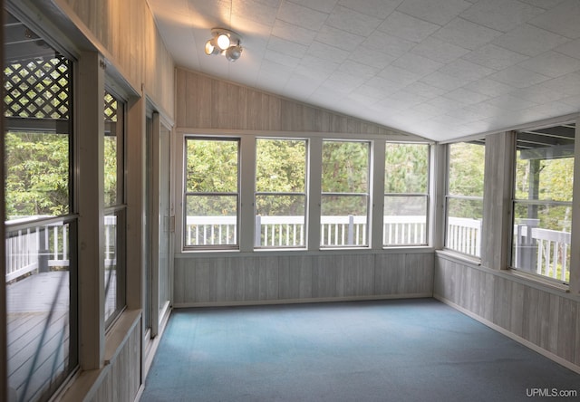 unfurnished sunroom with lofted ceiling