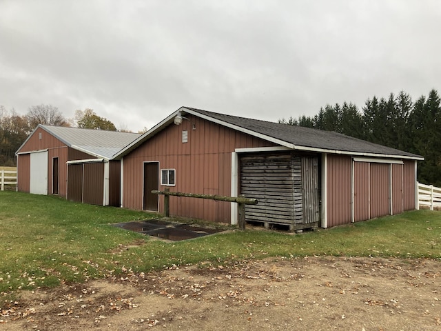 view of outdoor structure with a lawn