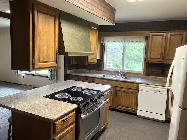 kitchen featuring white appliances, sink, a center island, decorative backsplash, and exhaust hood