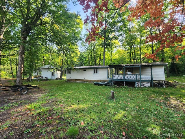 view of yard with a wooden deck