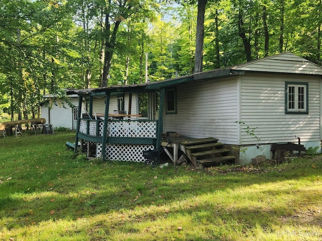 rear view of house with a yard