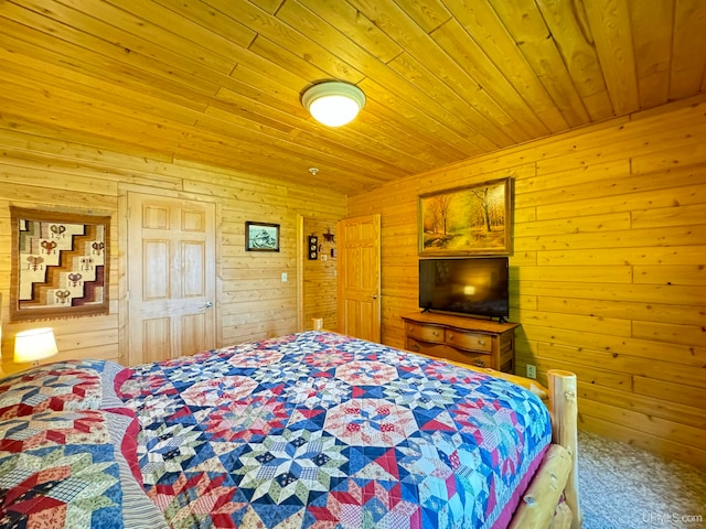 bedroom with wood ceiling, wooden walls, and carpet flooring