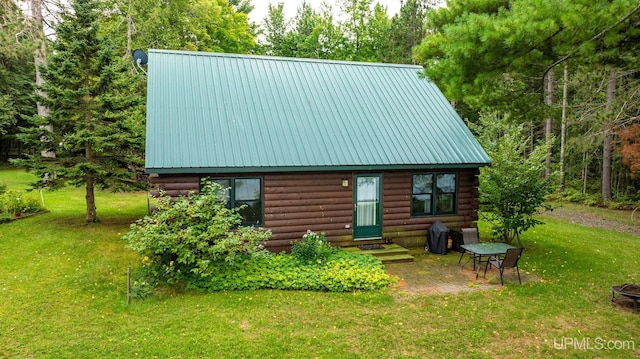 back of house with a yard