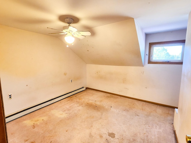 bonus room featuring lofted ceiling, light colored carpet, baseboard heating, and ceiling fan