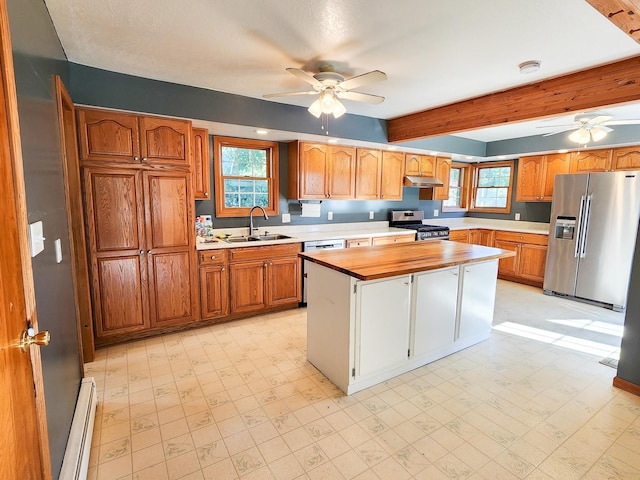 295 W Birch St, Harrison, MI 48625 - kitchen featuring appliances with stainless steel finishes, a ceiling fan, a baseboard radiator, light floors, and beam ceiling