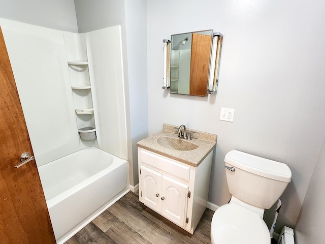 295 W Birch St, Harrison, MI 48625 - full bath with vanity, wood finished floors, tub / shower combination, and baseboard heating