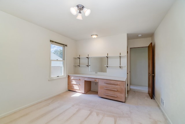 unfurnished office with light colored carpet