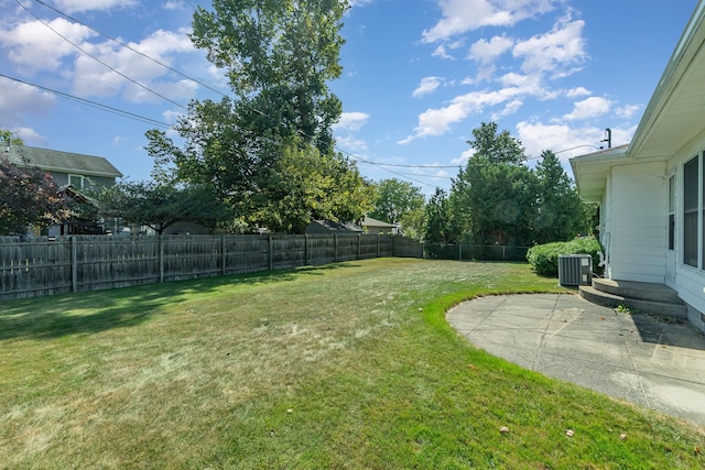 view of yard featuring cooling unit and a patio area